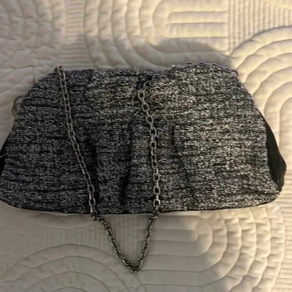 Shades of woven gray, and silver and black leather trim.Removable silver chain